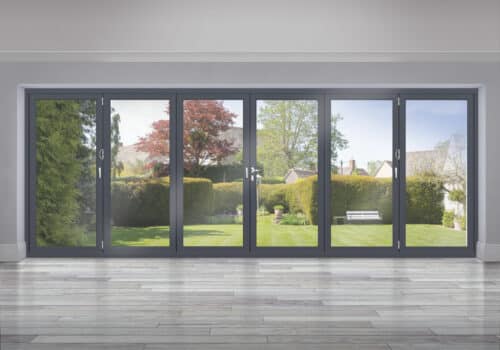 grey six panel closed origin bifold doors with garden view