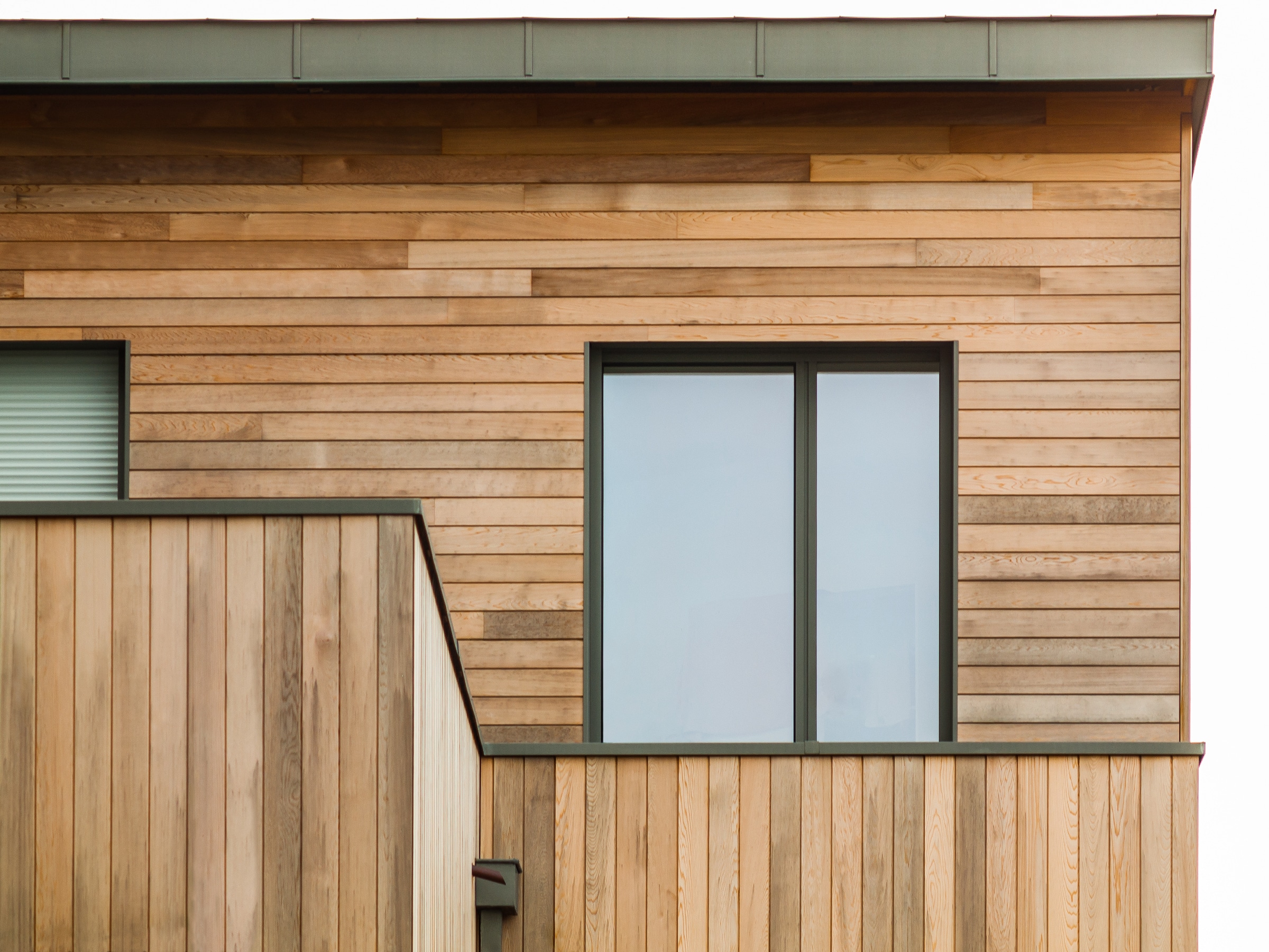 Exlabesa KC75 modern windows in a timber-clad house