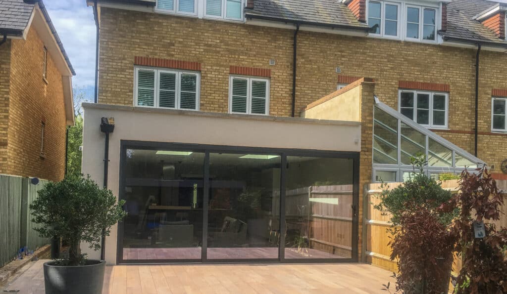 Picture of an end terrace modern house with sliding doors extension on the back