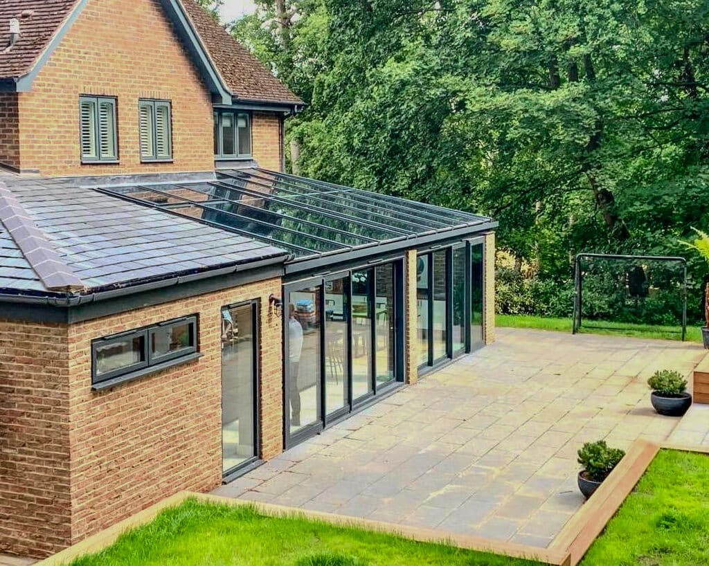 picture of a modern family house with a glazed extension on the back