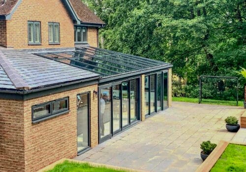 picture of a modern family house with a glazed extension on the back