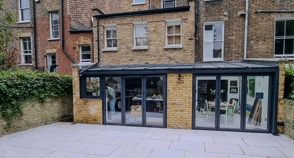 Picture of an end terrace modern house with sliding doors extension on the back