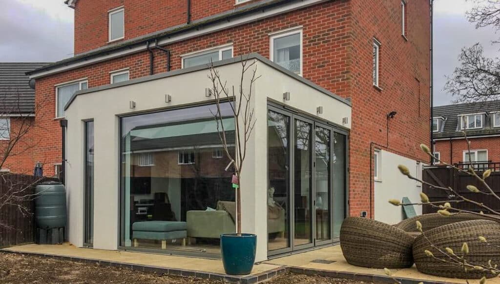 modern house with a bifold door extension on the back