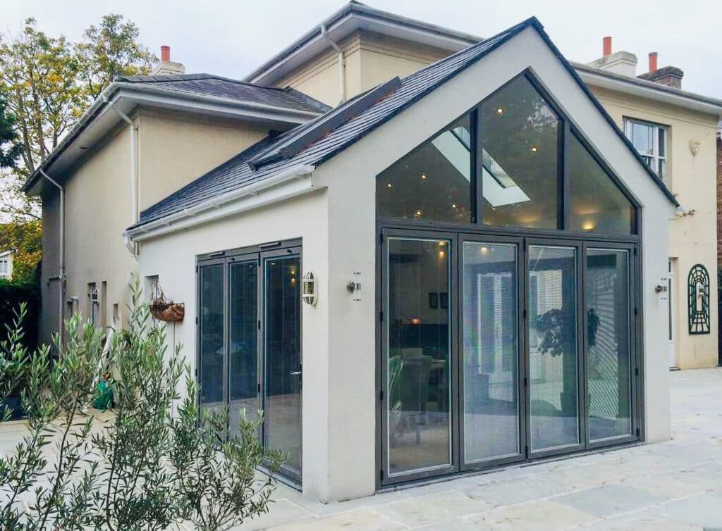 picture of aluminium doors and windows with bifold doors in a new extension of Surrey House