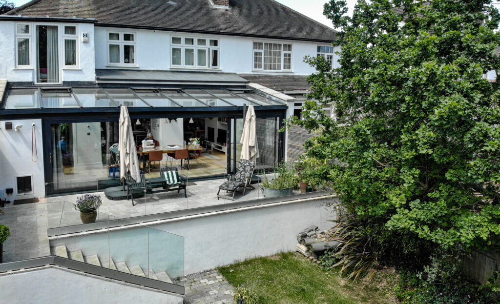 picture of a family home with a glazed extension in the back