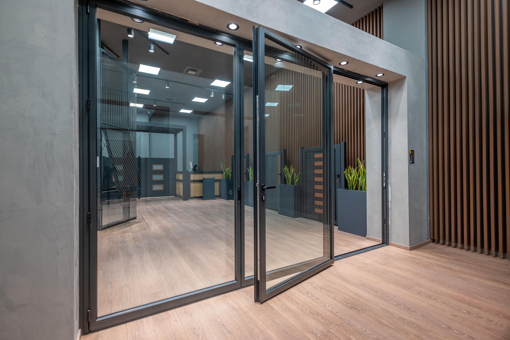 alumil MF65 grey bifold in a showroom