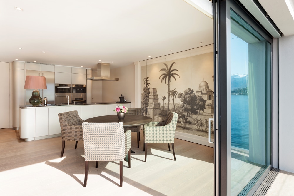 fully open alumil M450 sliding doors leading to kitchen living space